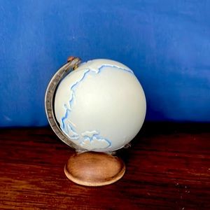 Hummel figurine touching earth